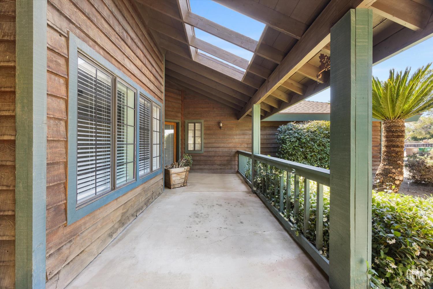 Undisclosed Address Bakersfield, CA 93314 - Photo 12 of 69 a view of a porch with wooden floor and stairs