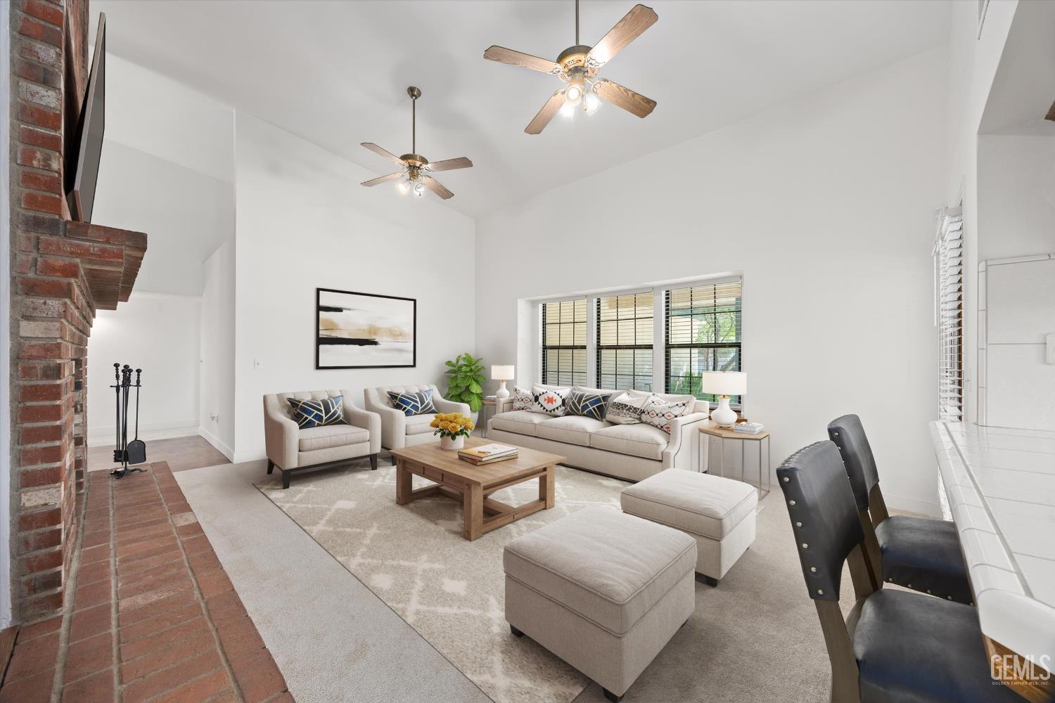 Undisclosed Address Bakersfield, CA 93314 - Photo 14 of 69 a living room with furniture a chandelier fan and a window