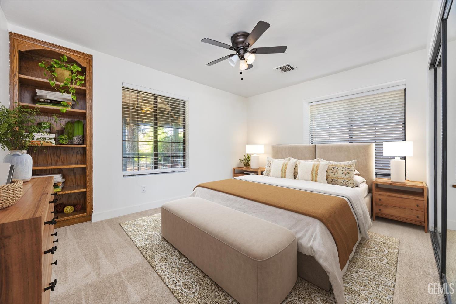 Undisclosed Address Bakersfield, CA 93314 - Photo 17 of 69 a spacious bedroom with a large bed and a window