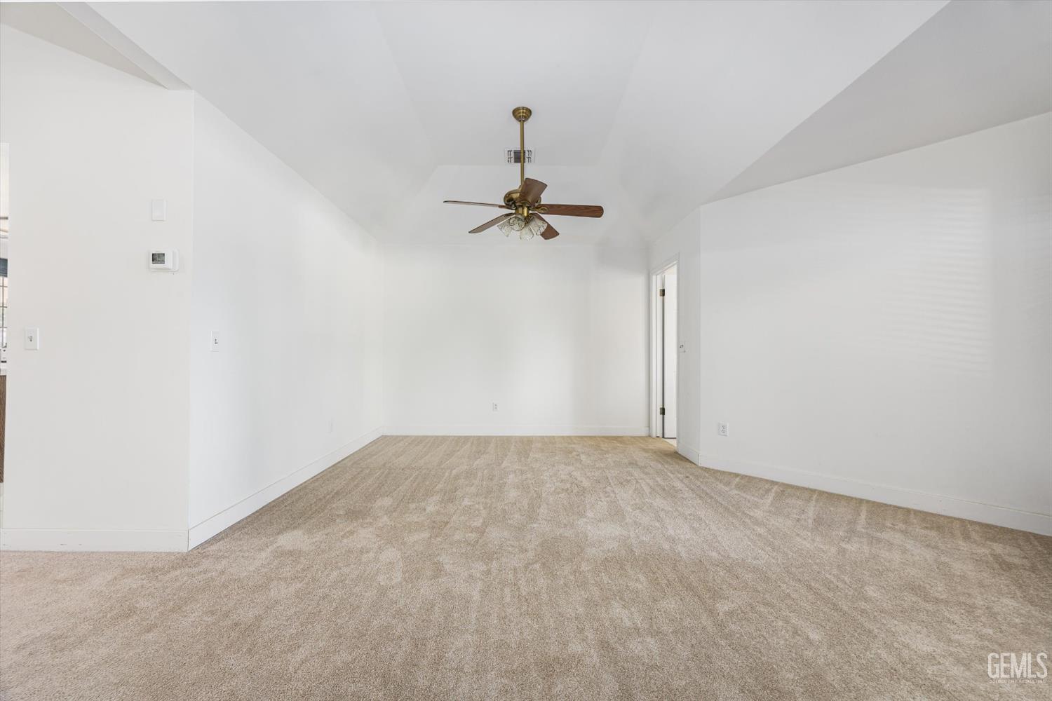 Undisclosed Address Bakersfield, CA 93314 - Photo 25 of 69 a view of a room with a ceiling fan