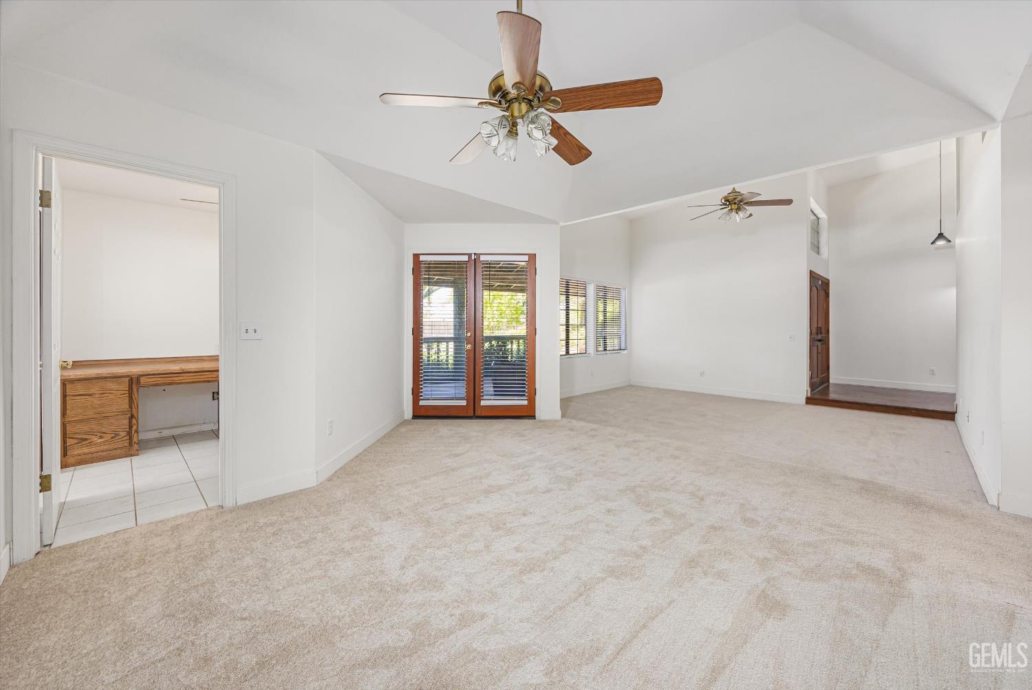 Undisclosed Address Bakersfield, CA 93314 - Photo 26 of 69 a view of a livingroom with a ceiling fan and window