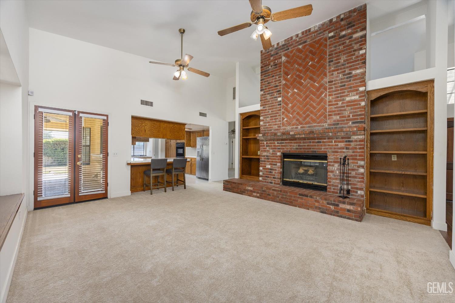 Undisclosed Address Bakersfield, CA 93314 - Photo 28 of 69 an empty room with furniture and a fireplace