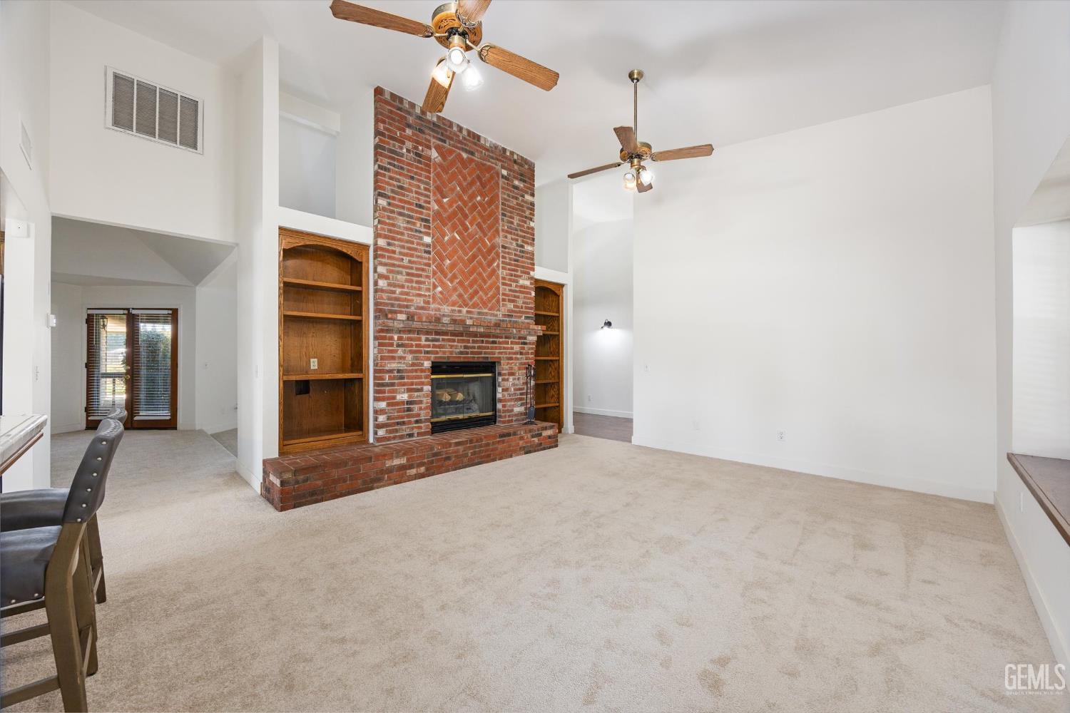 Undisclosed Address Bakersfield, CA 93314 - Photo 29 of 69 an empty room with windows and fireplace