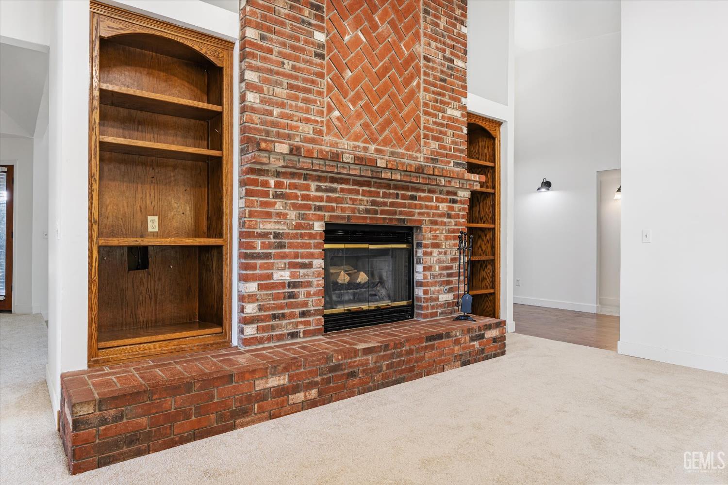 Undisclosed Address Bakersfield, CA 93314 - Photo 30 of 69 a living room with a fireplace