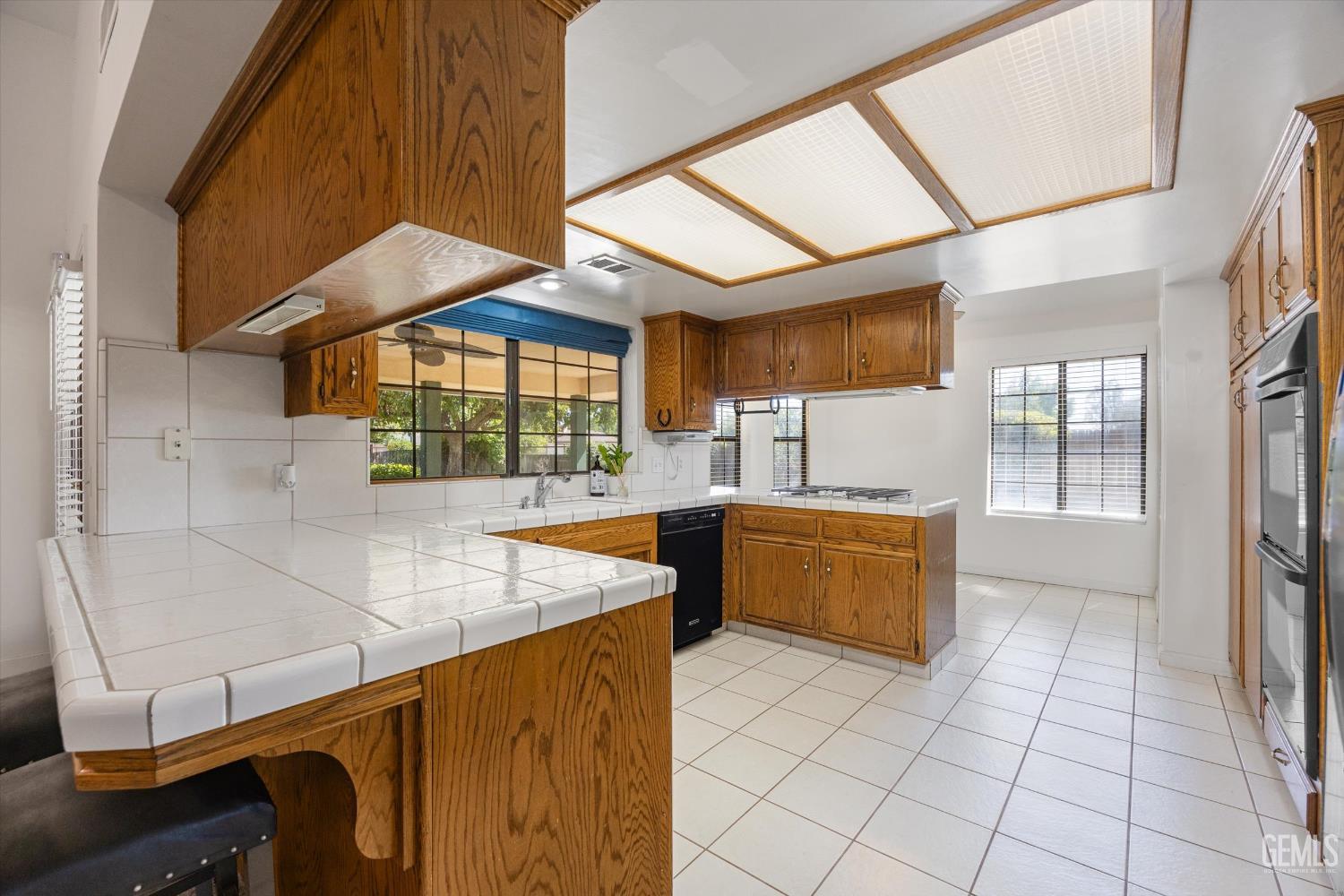 Undisclosed Address Bakersfield, CA 93314 - Photo 32 of 69 a kitchen with stainless steel appliances cabinets a stove and a window