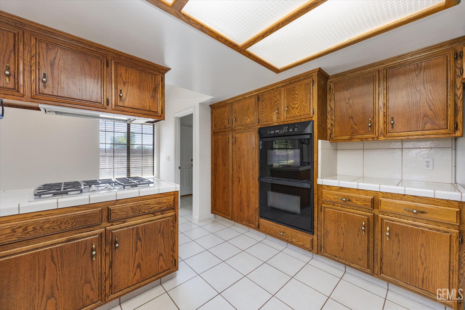 Undisclosed Address Bakersfield, CA 93314 - Photo 35 of 69 a kitchen with stainless steel appliances granite countertop a refrigerator and cabinets