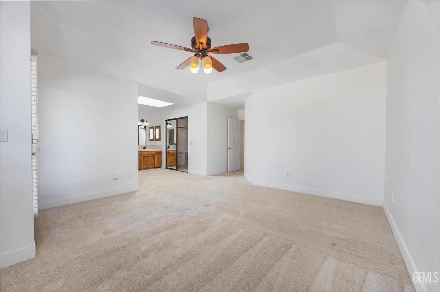 Undisclosed Address Bakersfield, CA 93314 - Photo 39 of 69 a view of an empty room with a ceiling fan