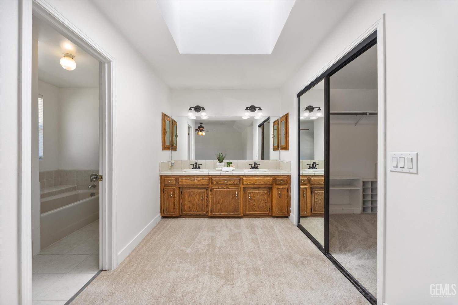 Undisclosed Address Bakersfield, CA 93314 - Photo 40 of 69 a large bathroom with a glass shower door and a sink