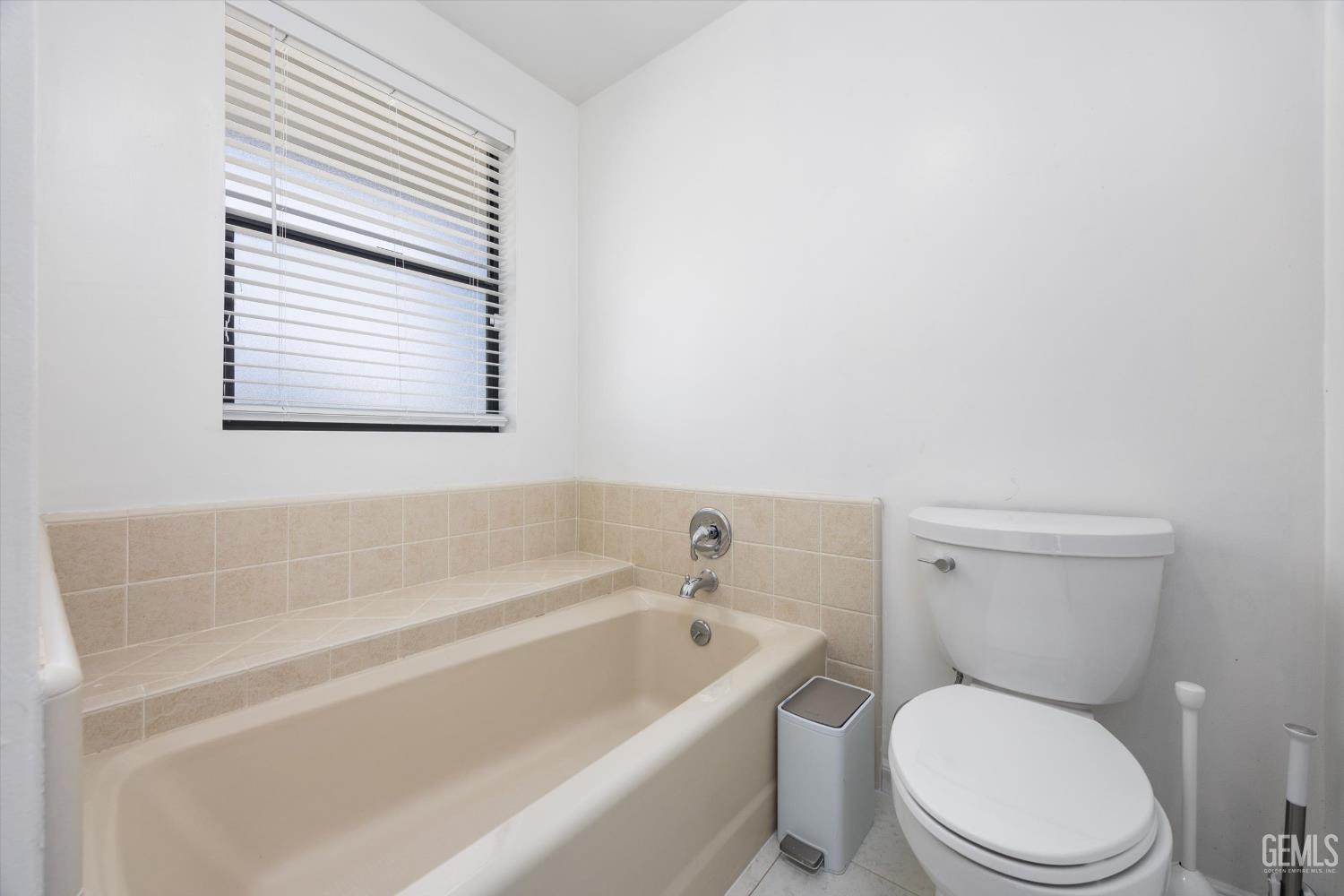 Undisclosed Address Bakersfield, CA 93314 - Photo 41 of 69 a white toilet sitting next to a bath tub