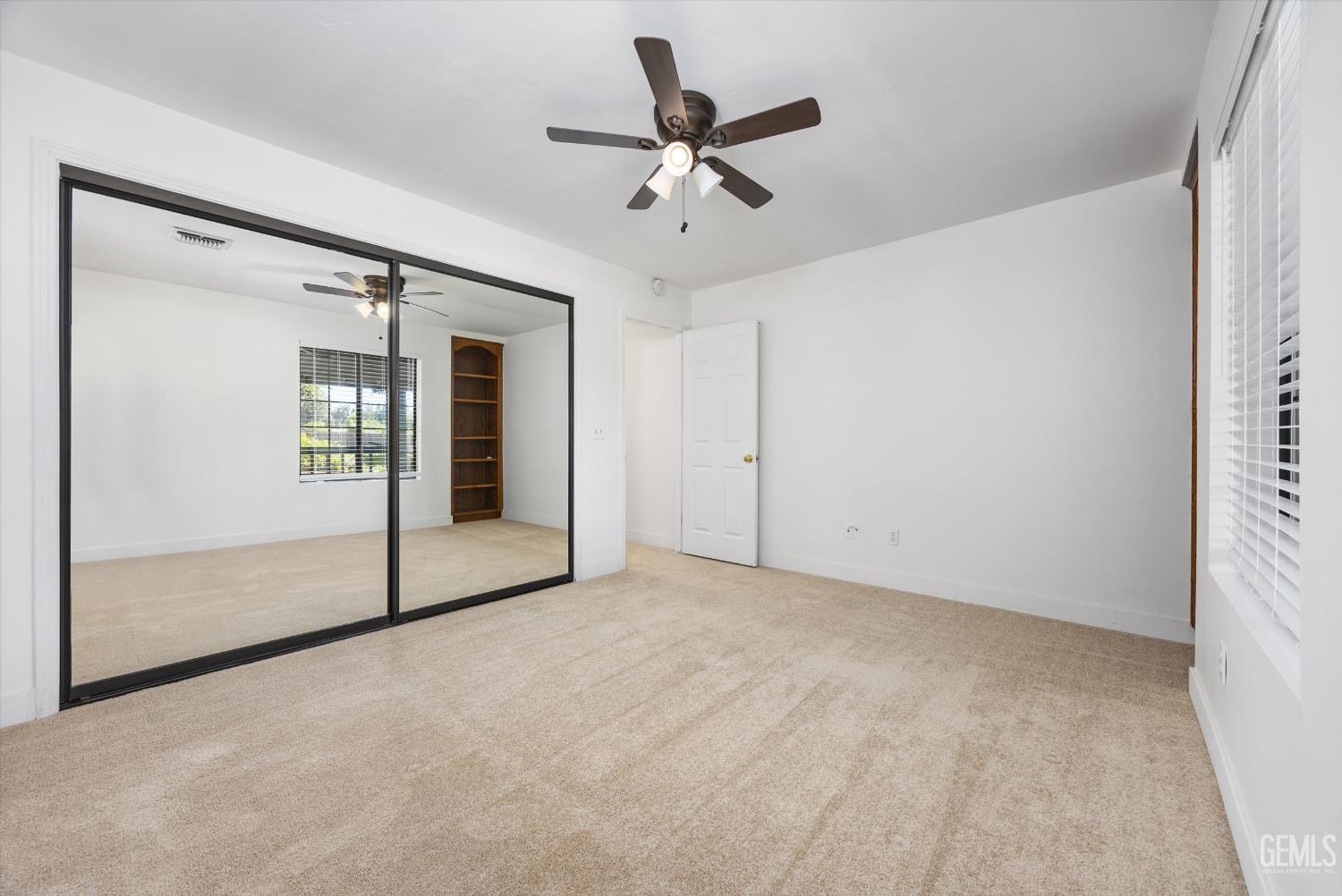 Undisclosed Address Bakersfield, CA 93314 - Photo 44 of 69 a view of a livingroom with a ceiling fan and window
