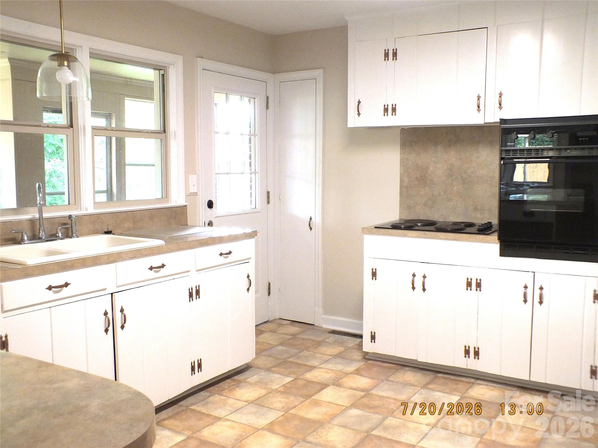 414 West Springs Street Lancaster, SC 29720 - Photo 8 of 22 a kitchen with a stove a sink and a refrigerator