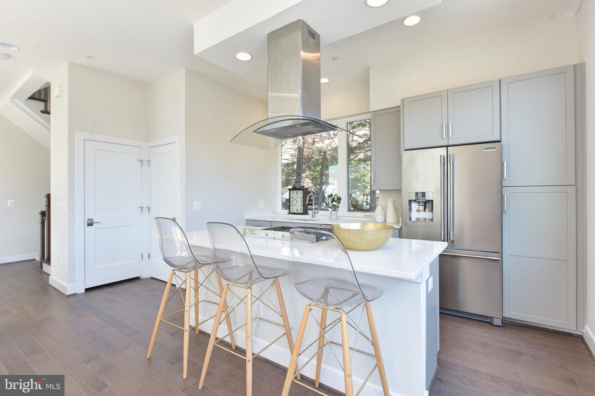 2823 24th Road South Arlington, VA 22206 - Photo 3 of 97 a kitchen with stainless steel appliances a refrigerator a table and chairs