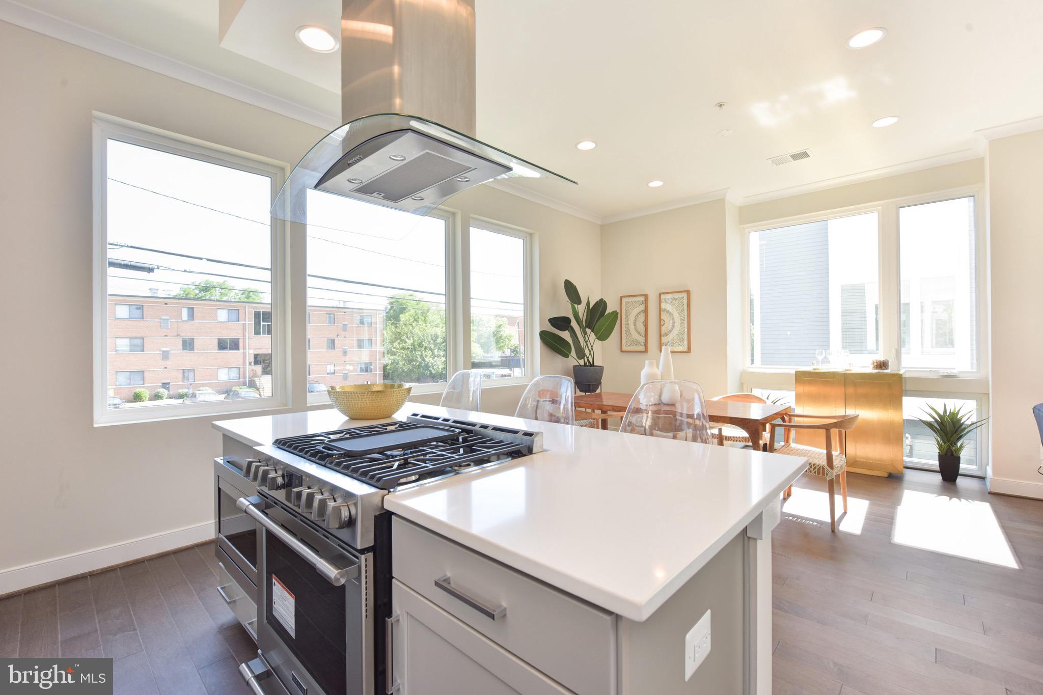 2823 24th Road South Arlington, VA 22206 - Photo 4 of 97 a kitchen that has a stove and a table in it