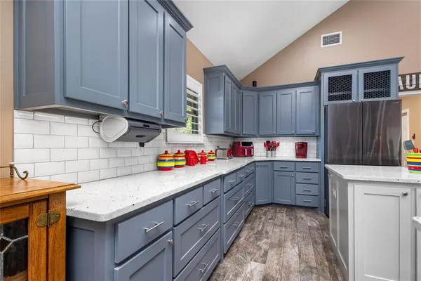 a work room with furniture and wooden floor