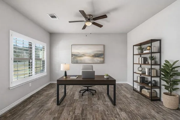 a spacious bedroom with a bed and a chandelier