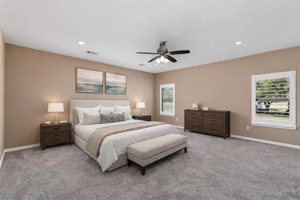 a bathroom with a sink vanity and mirror