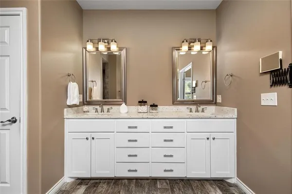 a spacious bathroom with a tub and shower