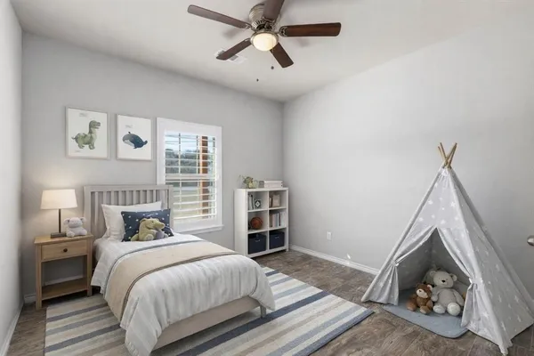 a bathroom with a granite countertop bathtub shower sink vanity and toilet