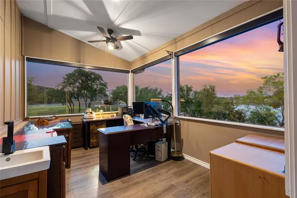 a balcony with furniture and wooden floor