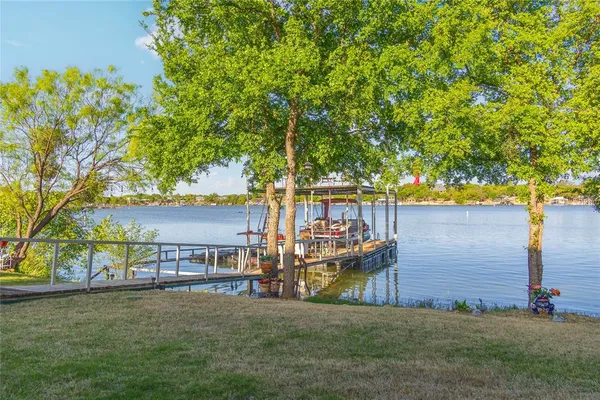 a small pool with lawn chairs