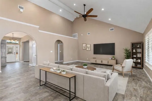 a view of a dining room with furniture and wooden floor