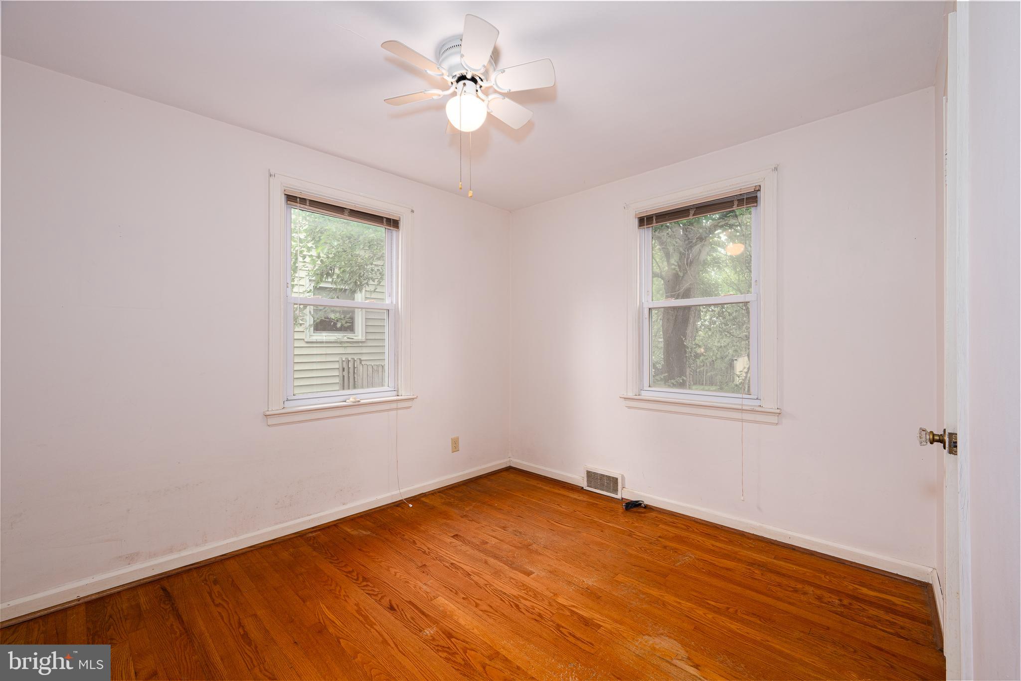 2 Norva Avenue Frederick, MD 21701 - Photo 15 of 36 an empty room with wooden floor and windows
