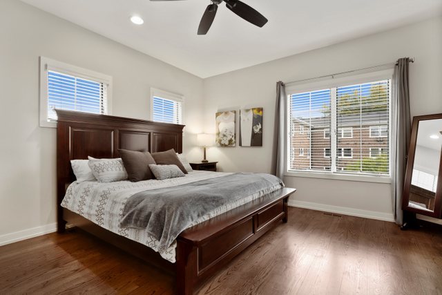 1027 Walnut Way Oak Park, IL 60302 - Photo 20 of 35 a spacious bedroom with a bed and wooden floor