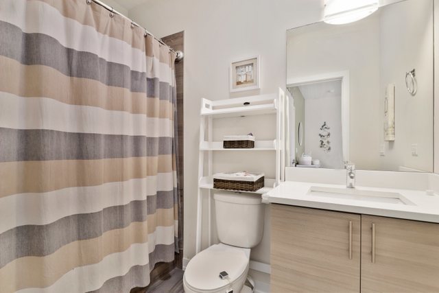 1027 Walnut Way Oak Park, IL 60302 - Photo 27 of 35 a bathroom with a sink toilet and shower