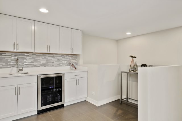 1027 Walnut Way Oak Park, IL 60302 - Photo 29 of 35 a view of a kitchen with sink dryer and washer