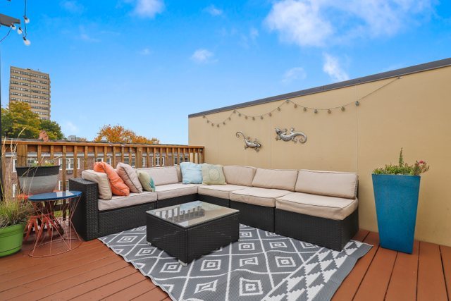 1027 Walnut Way Oak Park, IL 60302 - Photo 30 of 35 a roof deck with couches and potted plants
