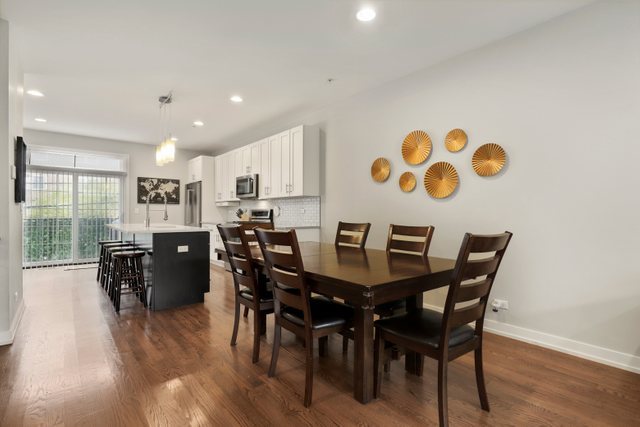 1027 Walnut Way Oak Park, IL 60302 - Photo 9 of 35 a view of a dining room with furniture and wooden floor