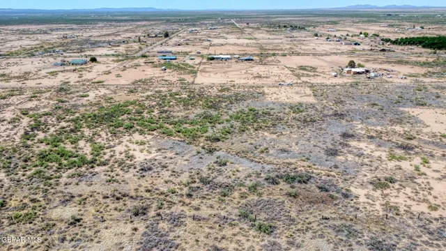 a view of a field with an ocean view