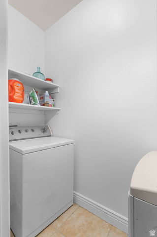 476 West 200 N Street, Unit 206 Springville, UT 84663 - Photo 18 of 24 Laundry room with light tile patterned floors and washing machine and clothes dryer