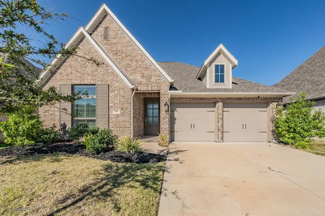 a large white living room with stainless steel appliances kitchen island a large counter top and a view of living room