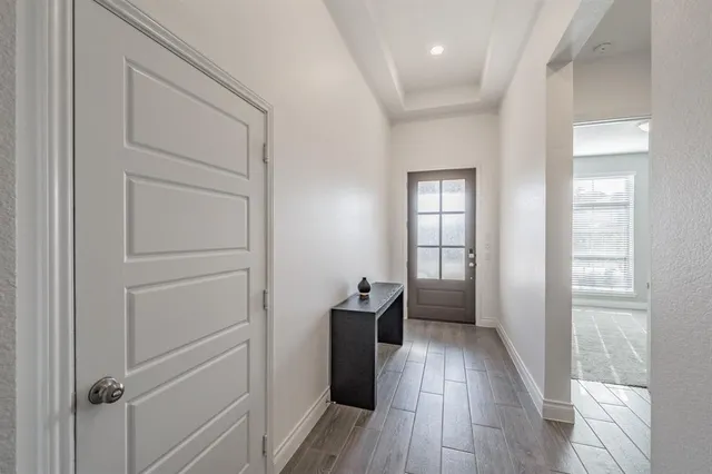 a living room with furniture a fireplace and a potted plant