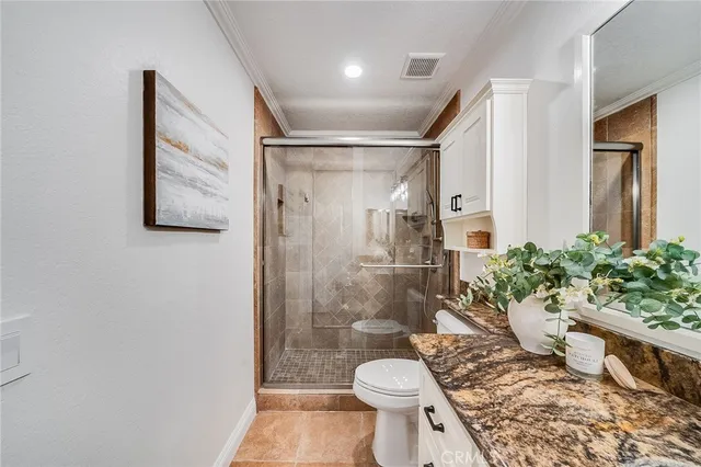 a bathroom with a shower toilet and sink