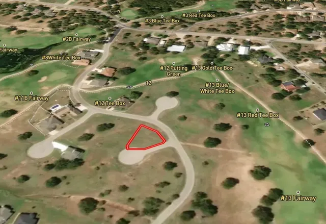 an aerial view of a wooden house with a swimming pool