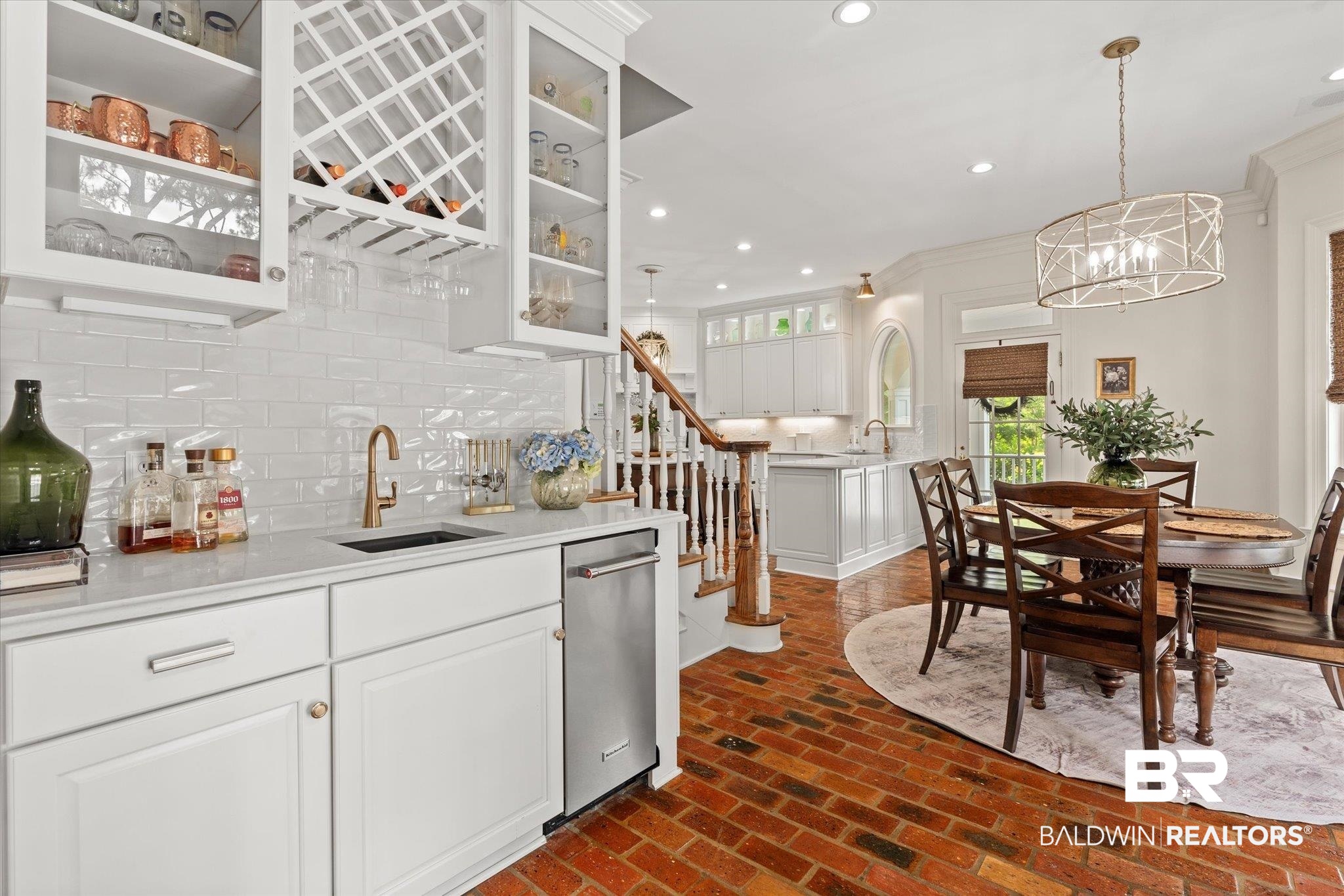 8561 Dawes Lake Road Mobile, AL 36619 - Photo 12 of 63 Kitchen featuring brick floors, recessed lighting, tasteful backsplash, glass insert cabinets, and light countertops