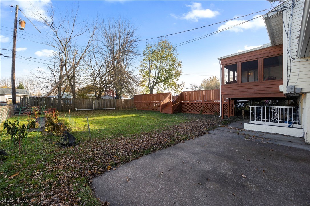 2156 South Oldgate Road Sandusky, OH 44870 - Photo 5 of 6 Fenced backyard with a sunroom, a patio area, and a deck