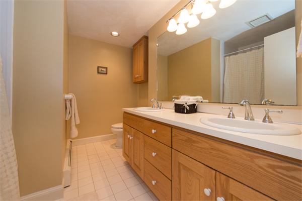 13 West Parish Road Boxford, MA 01921 - Photo 24 of 30 a bathroom with a double vanity sink a mirror and a shower