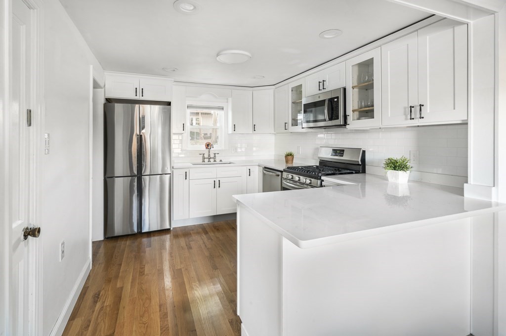 30 Crawford Road Braintree, MA 02184 - Photo 3 of 21 a kitchen with stainless steel appliances granite countertop a refrigerator sink and microwave