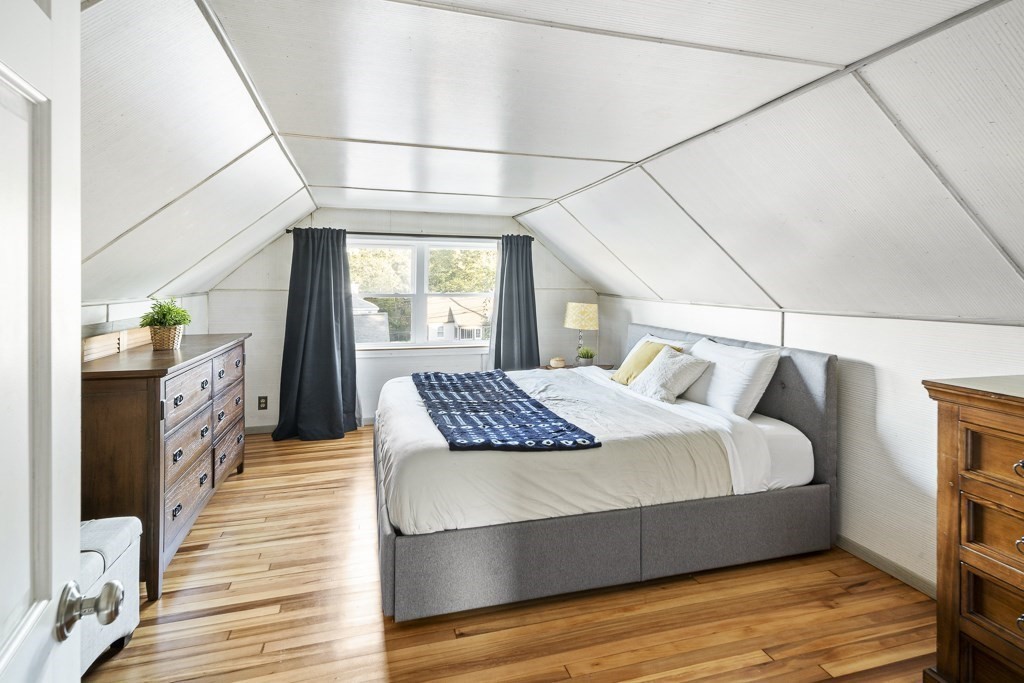 30 Crawford Road Braintree, MA 02184 - Photo 9 of 21 a bedroom with a bed and wooden floor