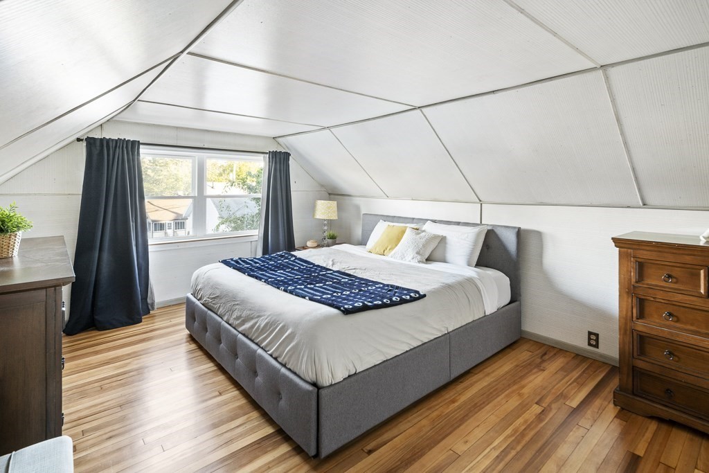 30 Crawford Road Braintree, MA 02184 - Photo 10 of 21 a bedroom with a bed and wooden floor