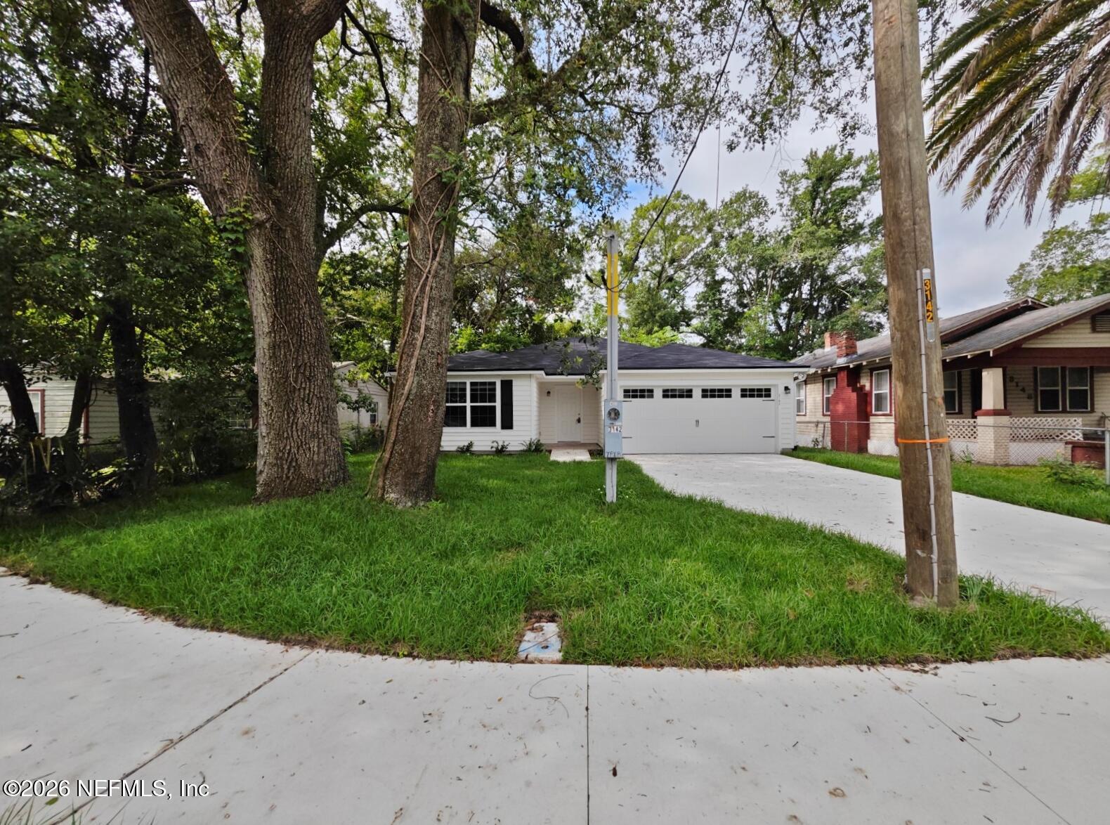 3142 Rosselle Street Jacksonville, FL 32205 - Photo 2 of 7 front view of a house with a yard