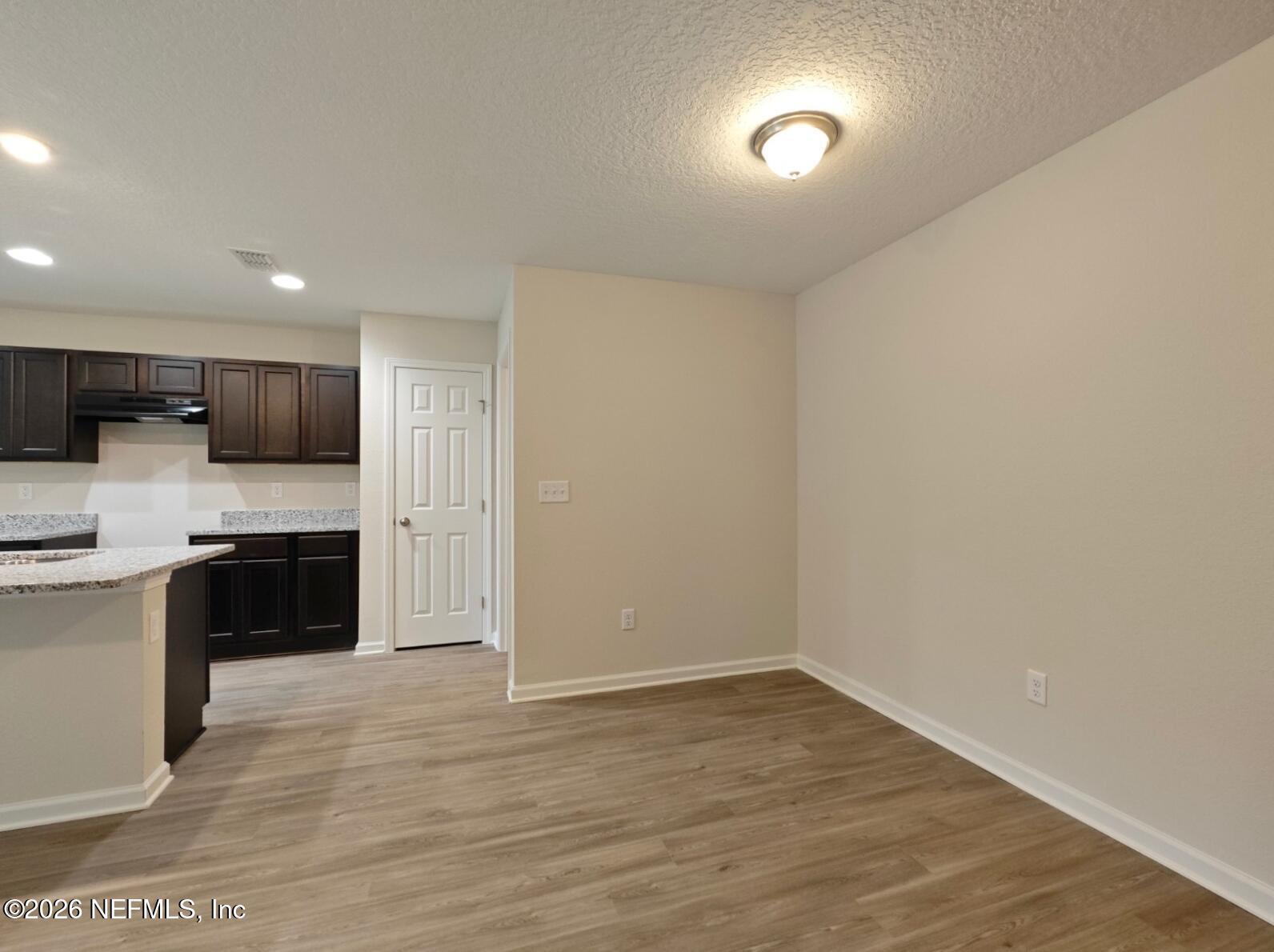 3142 Rosselle Street Jacksonville, FL 32205 - Photo 6 of 7 a large kitchen with stainless steel appliances granite countertop a stove a sink and a refrigerator