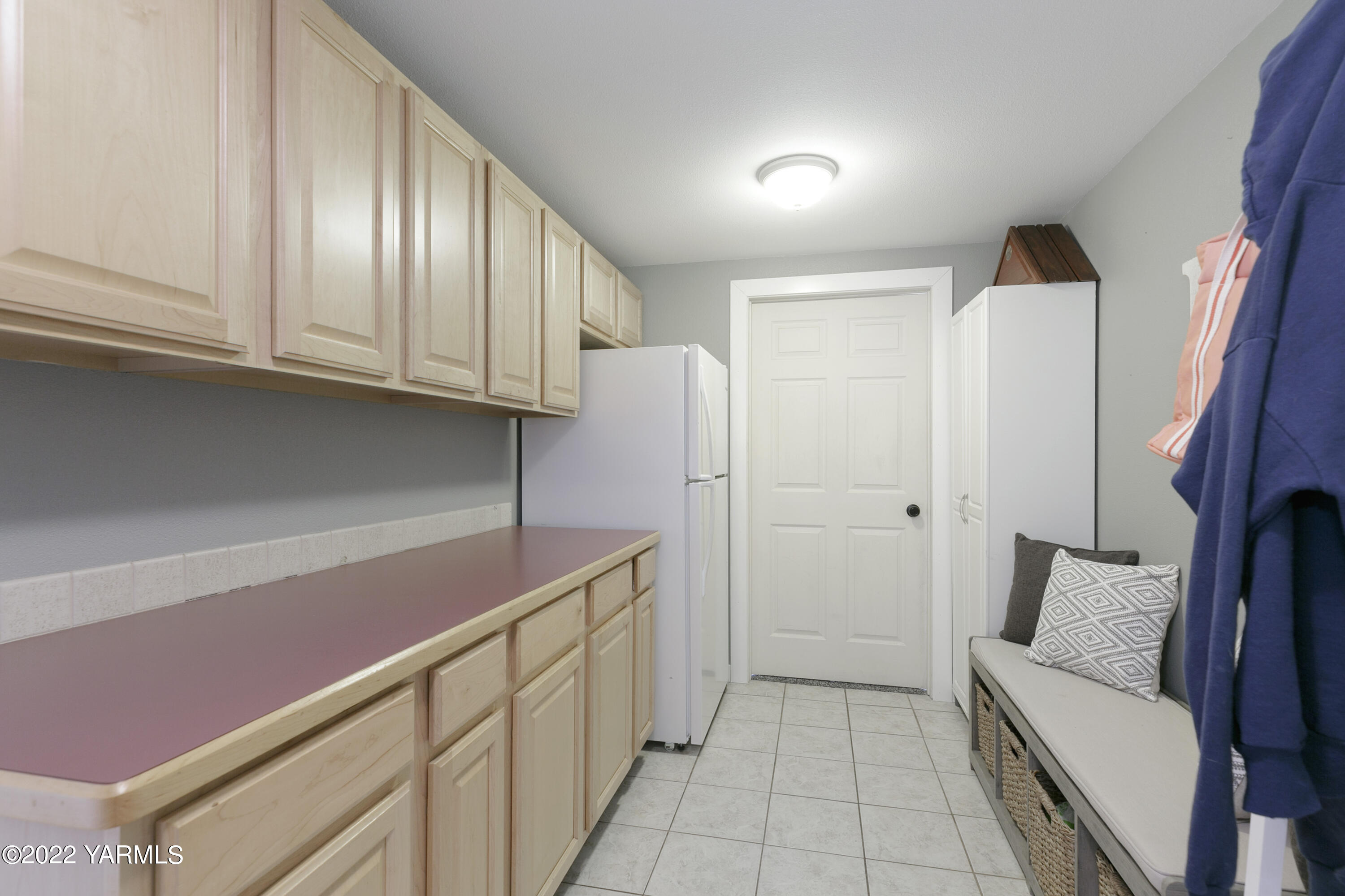 7501 Bell Road Moxee, WA 98936 - Photo 12 of 18 a kitchen with cabinets and a refrigerator