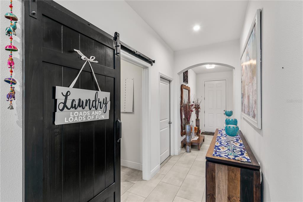 5637 Beggs Road St. Cloud, FL 34771 - Photo 10 of 35 a view of an entryway door the hallway and a wooden floor