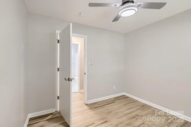 an empty room with a mirror