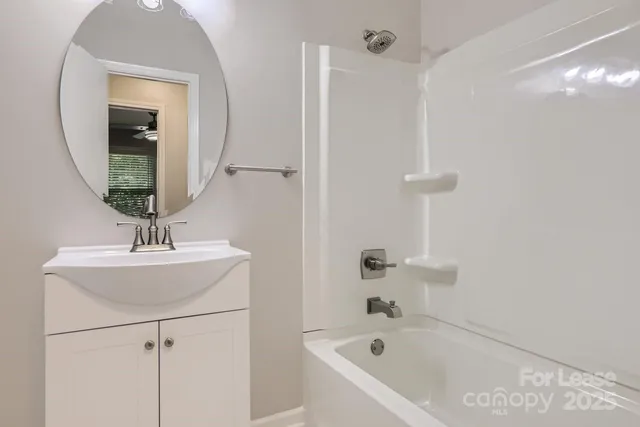 a bathroom with a bathtub and a sink