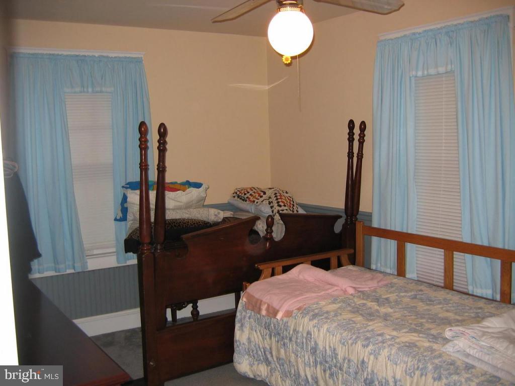 339 Front Street Lititz, PA 17543 - Photo 11 of 16 a bedroom with a bed and wooden floor